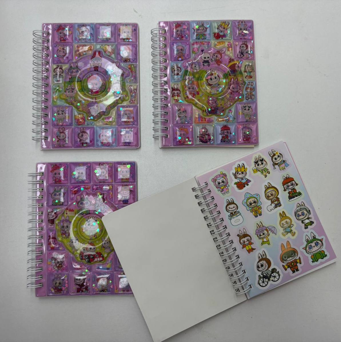 Cuaderno pasta de agua con  Stikers Grandecitos  8.0